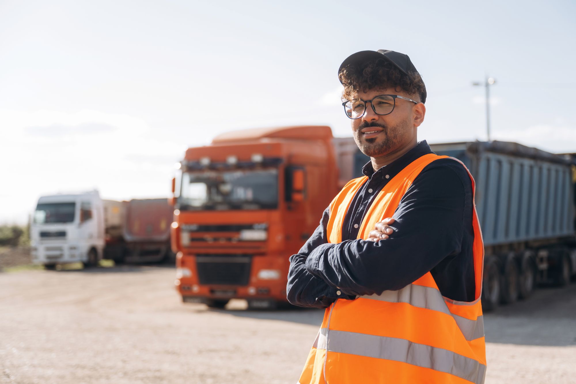 Smiling truck driver in a safety vest